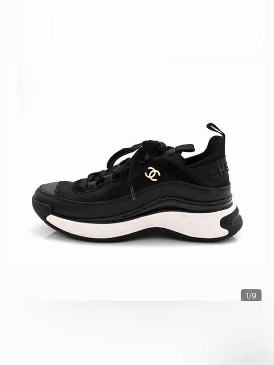 CHANEL Shoes - CHANEL Black and White Women's Quilted-Trim Sneakers with Gold CC